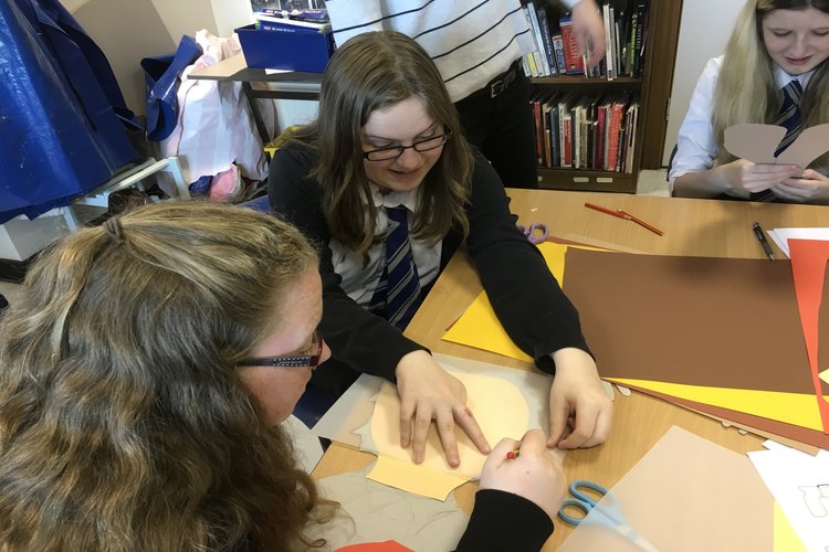 3 girls around a craft table